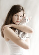 The girl with a white kitten The girl with a white kitten