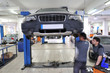 Photo: Auto mechanics working under the car - a series of MECHANIC Auto mechanics working under the car - a series of MECHANIC