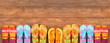 Brightly colored flip-flops on wood Brightly colored flip-flops on wood