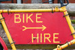 bike hire sign on a rusty frame