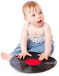 The small child with a black gramophone record
