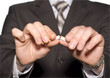 No smoking. A hand crushing cigarettes