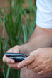 Hands of Man Texting on Smartphone Hands of Man Texting on Smartphone