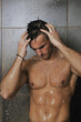 good looking man under man shower good looking man under man shower