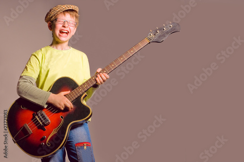 Photo: The boy with a guitar The boy with a guitar
