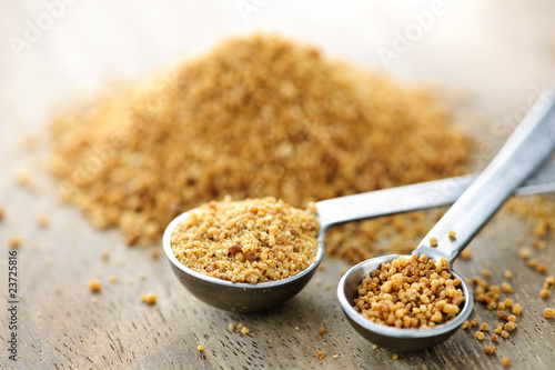 Photo: Coconut palm sugar in measuring spoons Coconut palm sugar in measuring spoons
