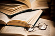 opened book, lying on the bookshelf