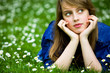 Young woman lying on the grass