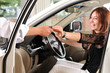 Car dealer giving keys of the new car to happy customer.