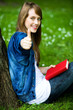Female student with thumbs up