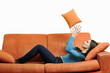 happy woman relax on orange sofa