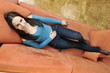 happy woman relax on orange sofa