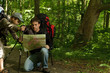 Father and son hiking in forest