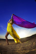 Foto: Girl at the beach on a background of the sun. Girl at the beach on a background of the sun.