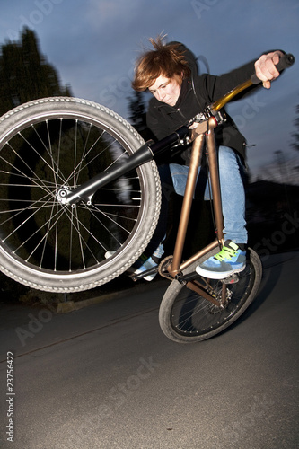 Photo: boy with dirtbike is going airborne boy with dirtbike is going airborne