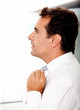 Business man fixing tie