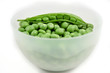 green peas in a bowl inside and outside of their pod green peas in a bowl inside and outside of their pod