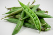 green peas in their pod isolated on white green peas in their pod isolated on white