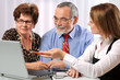 Senior couple meeting with agent or advisor Senior couple meeting with agent or advisor