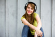Teenage girl wearing headphones