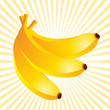 three bananas on yellow beams background