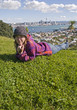Woman laying on the Grass at Victoria Mount, Auckland