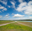 two rural road in green field two rural road in green field