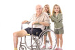 twin sisters pushing eldery man in wheelchair twin sisters pushing eldery man in wheelchair