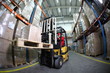 forklift operator at work in warehouse