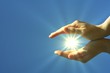 hand sun and blue sky