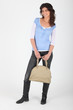 Photos : Young woman with a bag on white background
