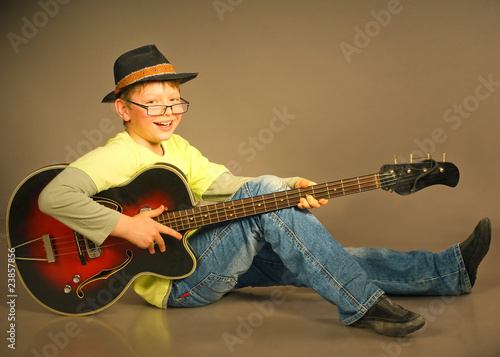 Photo: The boy with a guitar The boy with a guitar