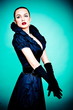 Beautiful fashion girl on the turquoise background Beautiful fashion girl on the turquoise background
