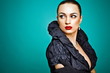 Beautiful fashion girl on the turquoise background Beautiful fashion girl on the turquoise background