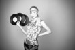 Beautiful fashion girl with plates for the gramophone Beautiful fashion girl with plates for the gramophone