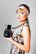 Beautiful fashion girl on the white background with camera Beautiful fashion girl on the white background with camera