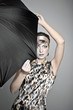 Beautiful fashion girl on the grey background with umbrella Beautiful fashion girl on the grey background with umbrella