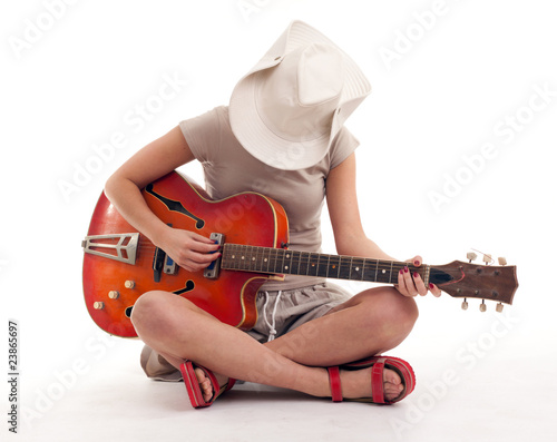 Photo: young woman playing electric guitar young woman playing electric guitar
