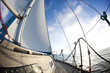 Sun behind white sails Sun behind white sails
