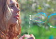 Young woman with soap bubbles