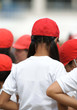 a girl wearing a red cap