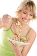 Woman eating bean sprouts Woman eating bean sprouts