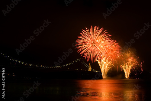 Photo: Fireworks over Tagus river, April 25th bridge. Lisboa, Portugal Fireworks over Tagus river, April 25th bridge. Lisboa, Portugal