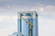 Crane and sky-scraper Crane and sky-scraper