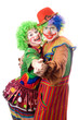 A couple of smiling clowns dancing