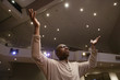 Photo : Man Worshipping In Church Man Worshipping In Church