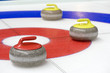 Group of curling rocks on ice Group of curling rocks on ice