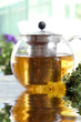 Herbal tea in teapot in the water