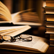 opened book, lying on the bookshelf