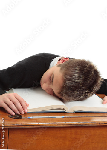 Photo: Tired or bored school student Tired or bored school student